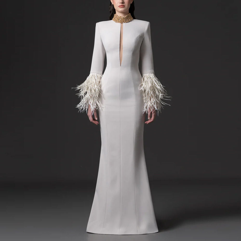 White beaded evening gown with rhinestones and feather trim, full-length view
